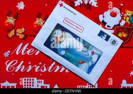 Post on Christmas mat - charity appeal, Christmas appeal from British Red Cross Stock Photo