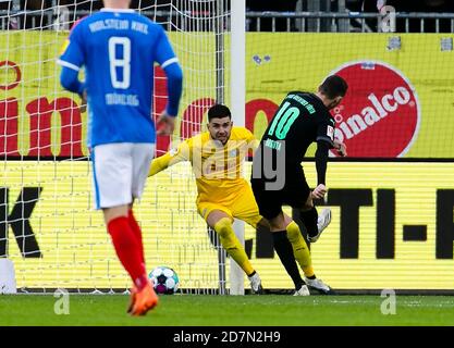 Kiel, Germany. 24th Oct, 2020. Football: 2nd Bundesliga, Holstein Kiel - SpVgg Greuther Fürth, 5th matchday. Fürth's Branimir Hrgota (r) scores for Fürth 2:0. In goal Ioannis Gelios (Holstein Kiel). Credit: Frank Molter/dpa - IMPORTANT NOTE: In accordance with the regulations of the DFL Deutsche Fußball Liga and the DFB Deutscher Fußball-Bund, it is prohibited to exploit or have exploited in the stadium and/or from the game taken photographs in the form of sequence images and/or video-like photo series./dpa/Alamy Live News Stock Photo