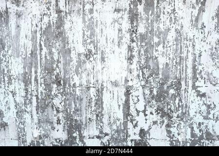 Peeling white paint on a metal surface. Stock Photo