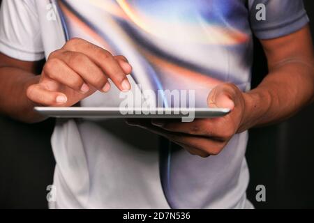 man hand using digital tablet on black background  Stock Photo