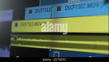 Movie editor adds footages on timeline doing video editing of project in computer program extreme close view Stock Photo