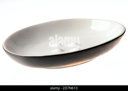 Empty soap plate isolated on white background. Oval, round dish for the soap Stock Photo