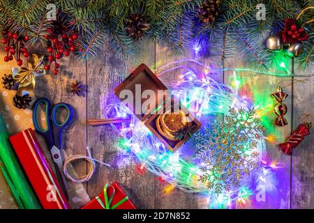 Christmas composition with a bright colored garland, Christmas lights and decorations, concept preparation for the new year and Christmas holidays. br Stock Photo