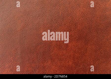 Texture of genuine leather, brown color, background, pattern for backdrop. Manufacturing of leather accessory concept Stock Photo
