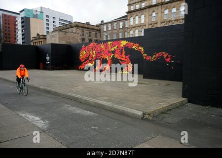 Glasgow, Clydeside, Scotland, UK. A large mural of a tiger painted on riverside wall along side the River Clyde, The mural painting was commissioned by a company called Tiger Beer in collaboration with artists. Different art work representing the elements of the Chinese Zodiac , water, earth, wood, fire and metal. This mural depicting fire was designed and produced McFaul Studio, whose creative director John McFaul hail from Glasgow Stock Photo