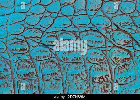 Texture of genuine leather with embossed scales reptiles, turquoise color, trendy pattern, natural background Stock Photo