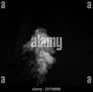 White smoke on black background. Figured smoke on a dark background. Abstract background, design element Stock Photo