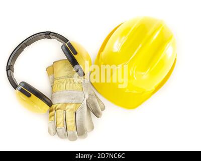 Yellow hard hat, leather protective gloves and earmuffs shot on white background Stock Photo
