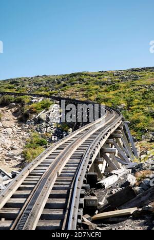 Mount Washington Cog Railway, New Hampshire - September 2008: Railway track disappearing into the distance over the top of the mountain. Stock Photo