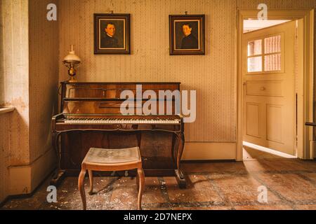 Urban Eploring in an old abandoned manor house, a Lost Place with antique furniture and wonderful architecture Stock Photo