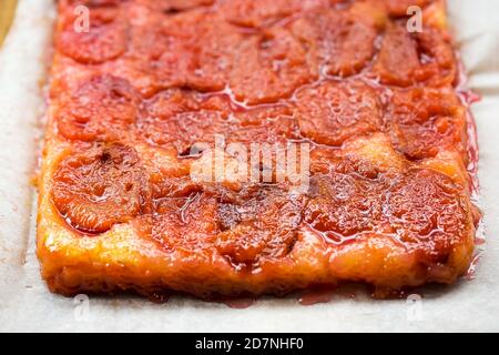 Plum tarte tatin, rectangle shape with cinnamon Stock Photo