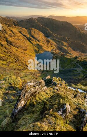 View of Low Water from the summit of The Old Man Of Coniston in the Lake District. Stock Photo