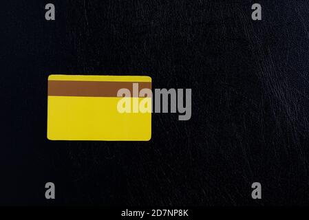 Blank golden credit card on black background Stock Photo