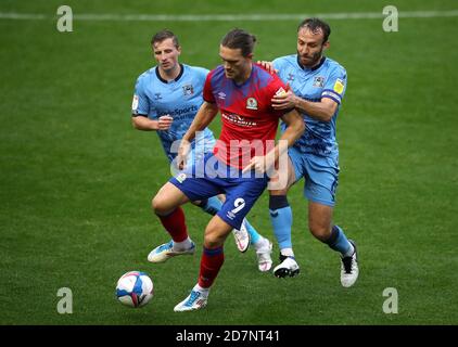 Blackburn Rovers' Sam Gallagher (centre) battles for the ball with Coventry City's Jamie Allen (left) and Liam Kelly during the Sky Bet Championship match at St Andrews, Birmingham. Stock Photo