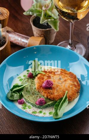 fish cutlet and broccoli puree Stock Photo