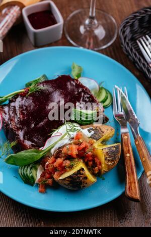 beef ribs in BBQ sauce with grilled vegetables Stock Photo