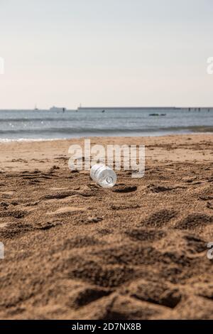 Plastic bottle thrown on the beach Stock Photo