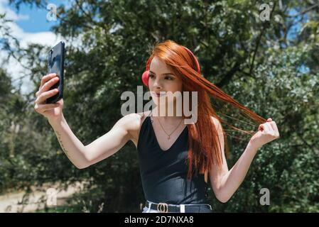 cute red hair girl making a selfie Stock Photo