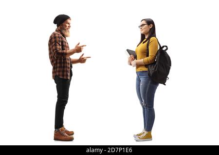 Full length profile shot of a bearded young man standing and talking to a female student isolated on white background Stock Photo