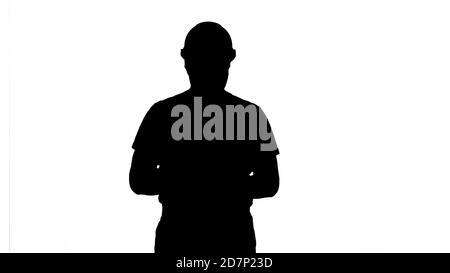 Silhouette Builder counting money standing. Stock Photo