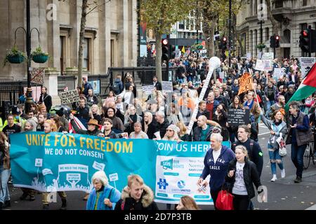 London, UK. 24th Oct, 2020. Demonstrators march through Leicester Square towards Trafalgar Square. Unite For Freedom movement organised a protest under the banner, We Have The Power, to show the forces that, they do not consent in what they see as an unlawful lockdown. Credit: Andy Barton/Alamy Live News Stock Photo