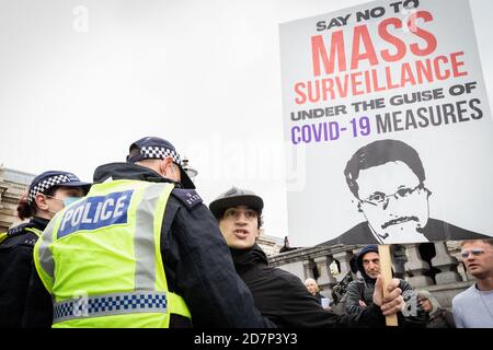 London, UK. 24th Oct, 2020. A man is restrained by the MET police at Trafalgar Square. Unite For Freedom movement organised a protest under the banner, We Have The Power, to show the forces that, they do not consent in what they see as an unlawful lockdown. Credit: Andy Barton/Alamy Live News Stock Photo