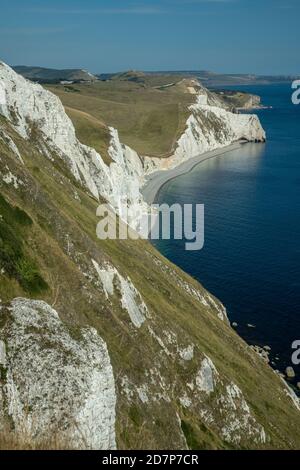 White chalk cliffs, looking east from White Nothe towards Swyre Head and Durdle Door, Dorset. Stock Photo
