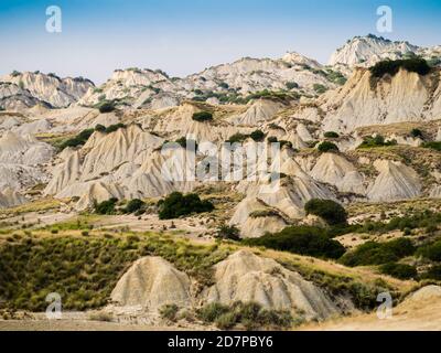 Dramatic view of Aliano badlands (calanchi), lunar landscape made of clay sculptures eroded by the rainwater, Basilicata region, southern Italy Stock Photo