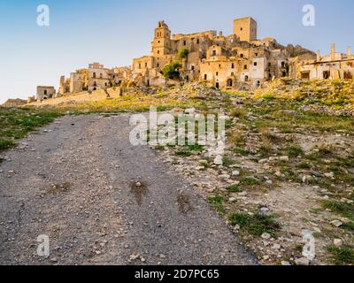 Dramatic view of Craco ruins, ghost town abandoned towards the end of the 20th century due to natural disaster, Basilicata region, southern Italy Stock Photo