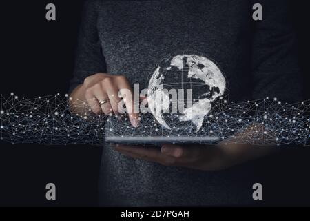 Close up of businessman holding digital globe in palm. Energy and ecology concept, Technologies connecting the world. Global network Stock Photo