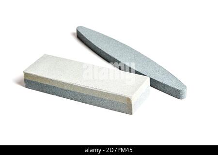 Two Sharpening stones. Grindstone or whetstone sharpener, isolated on white background. Kitchen utensils Stock Photo