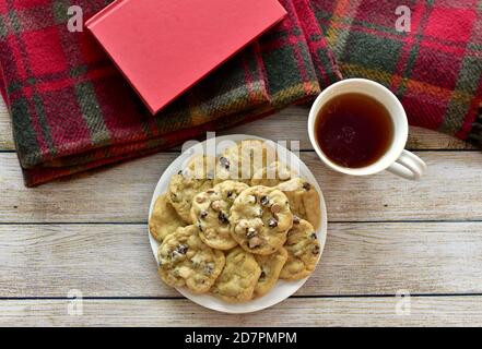 Fresh warm homemade cookies to relax and enjoy with tea and good book on cold winter afternoons lockdown at home Stock Photo