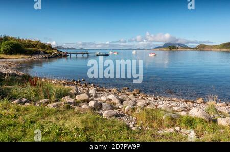 Fishing boats anchor in a fjord in summer, Nordland, Norway Stock Photo