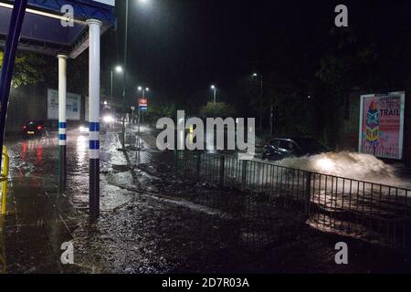Hertford, UK. 24th June 2020. Heavy rainfall in Hertford, UK. The Met Office has issued a yellow warning for wind and rain in the south east. The rain has caused flooding in areas and was the water was as deep aws some cars bonnets outside of Hertford North railway station. Credit: Andrew Steven Graham/Alamy Live News Stock Photo