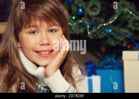 portrait of a teenage girl near Christmas tree Stock Photo