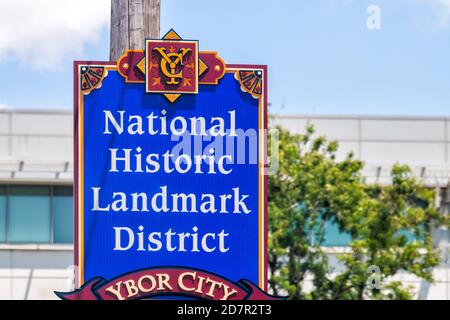 Tampa, USA - April 27, 2018: Downtown city in Florida with closeup of colorful blue sign for Ybor city national historic landmark district Stock Photo