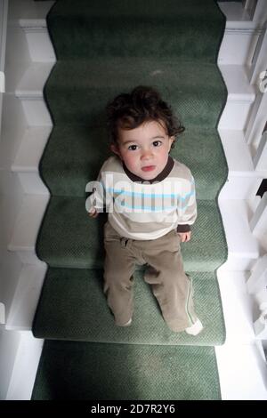 Male toddler on naughty step Stock Photo