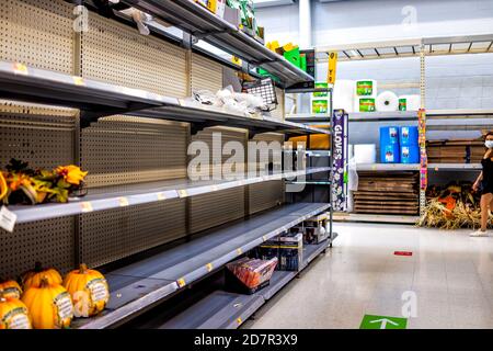 Sterling, USA - September 12, 2020: Walmart supermarket superstore shop interior inside empty shelves for gardening equipment with products goods aisl Stock Photo