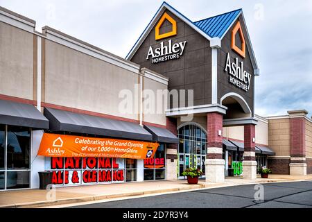 Sterling, USA - September 12, 2020: Ashley homestore sign by store entrance in Fairfax county, Virginia with banner for grand opening Stock Photo