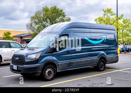 Sterling, USA - September 12, 2020: Amazon delivery van vehicle parked on parking lot of Walmart retail store with Prime logo on car Stock Photo