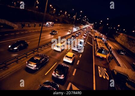 Warsaw, Poland - December 20, 2019: Above high angle aerial Dutch angle view of Aleja Armii Ludowej street avenue in Warszawa at night with traffic ca Stock Photo