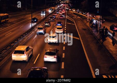 Warsaw, Poland - December 20, 2019: Above high angle aerial view of Aleja Armii Ludowej street avenue in Warszawa at night with traffic cars passing b Stock Photo