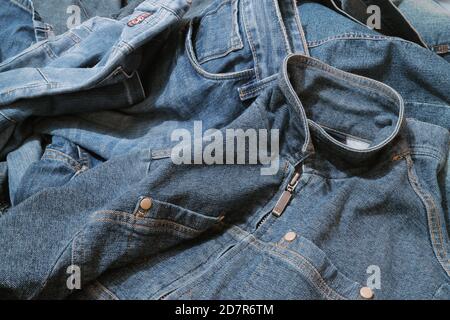 Textured background of blue denim jeans with seam and thread stitch. Stock Photo
