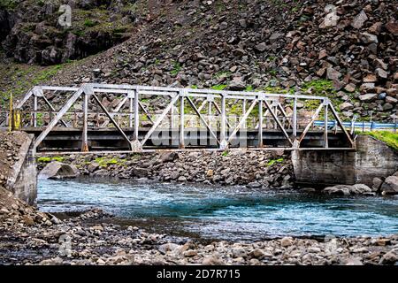 Ring road in east Iceland highway with bridge and colorful blue water nobody empty near Djupivogur Stock Photo