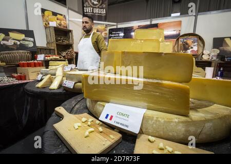 BELGRADE, SERBIA - FEBRUARY 24, 2019: Sliced wheels discs of Comte cheese for sale. Comte is a french cow unpasteurized cheese from the Franche-Comte Stock Photo