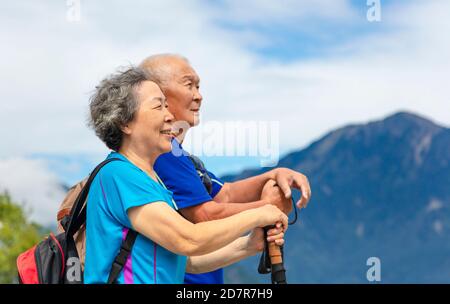 happy asian senior couple hiking in nature Stock Photo
