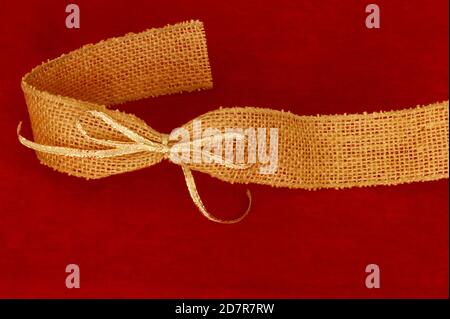 Pretty burlap bow and ribbon on white background Stock Photo - Alamy