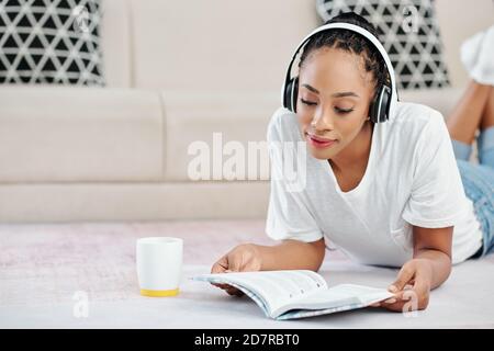Woman doing listening exercise Stock Photo