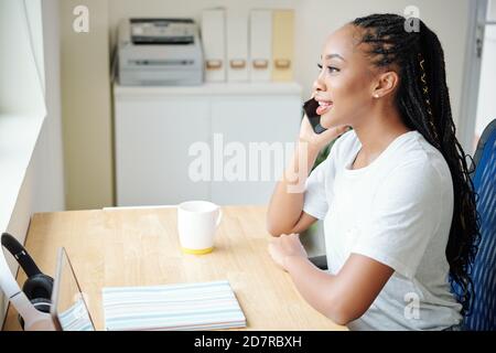 Woman working at home office Stock Photo