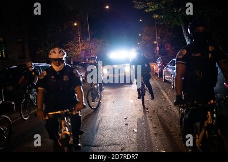 Washington, USA. 24th Oct, 2020. Police vehicles and officers on bicycles follow a protest march organized by the They/Them Collective in the memory of Dominique Mulkey, who was killed by police in Tampa, FL, earlier this week, in Washington, DC, on October 24, 2020 amid the coronavirus pandemic. Nearly 22 weeks after the police killing of George Floyd, near-daily protests demanding police reform and an end to systemic racism continued in Washington days after Mayor Muriel Bowser formally requested an increase in police funding.(Graeme Sloan/Sipa USA) Credit: Sipa USA/Alamy Live News Stock Photo